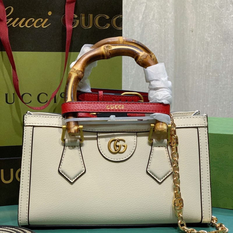 G*u*i top handle bags